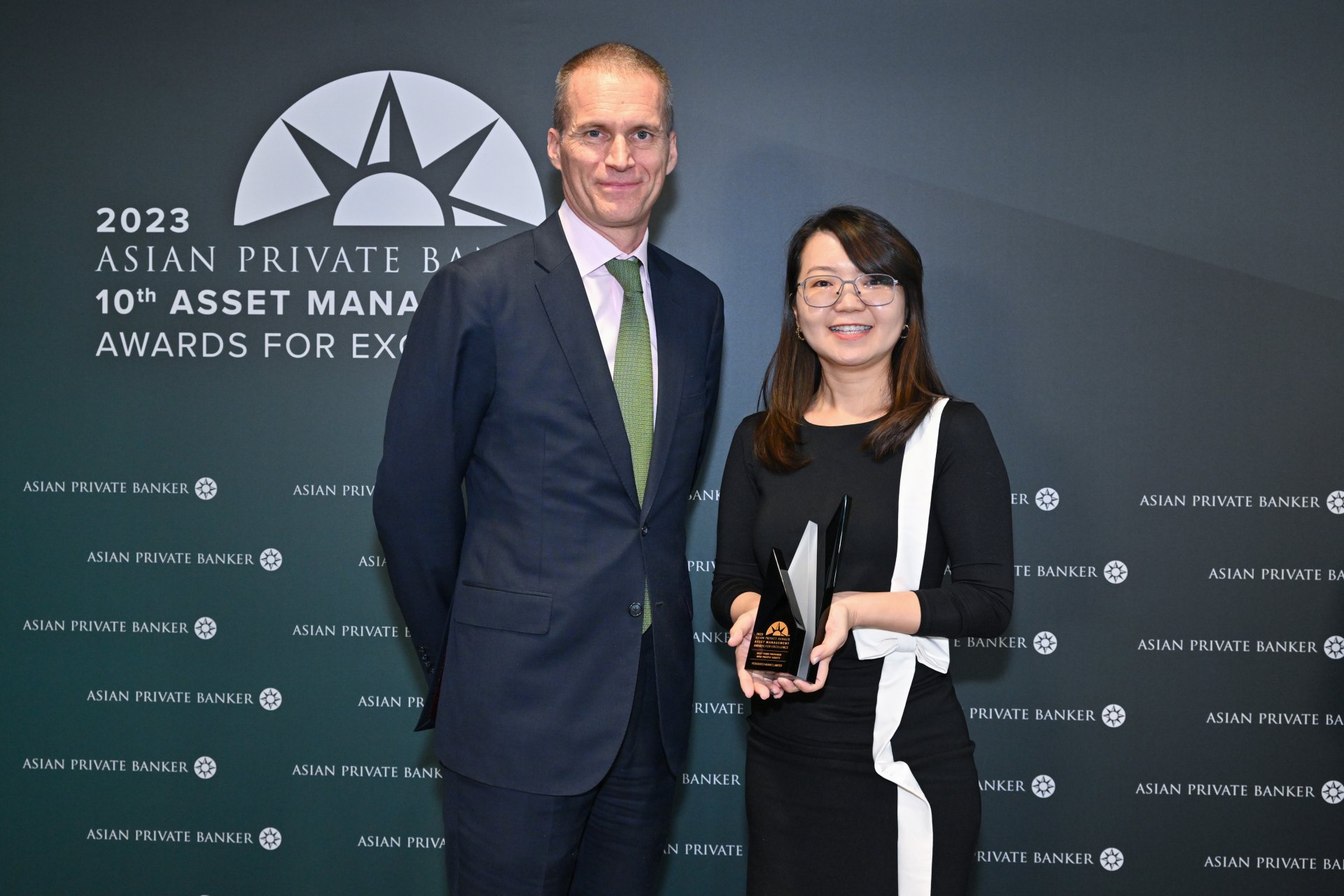 Jake Nilsson and MeiLin Tan of Federated Hermes collect their win for Best Fund Provider - Asia Pacific Equity