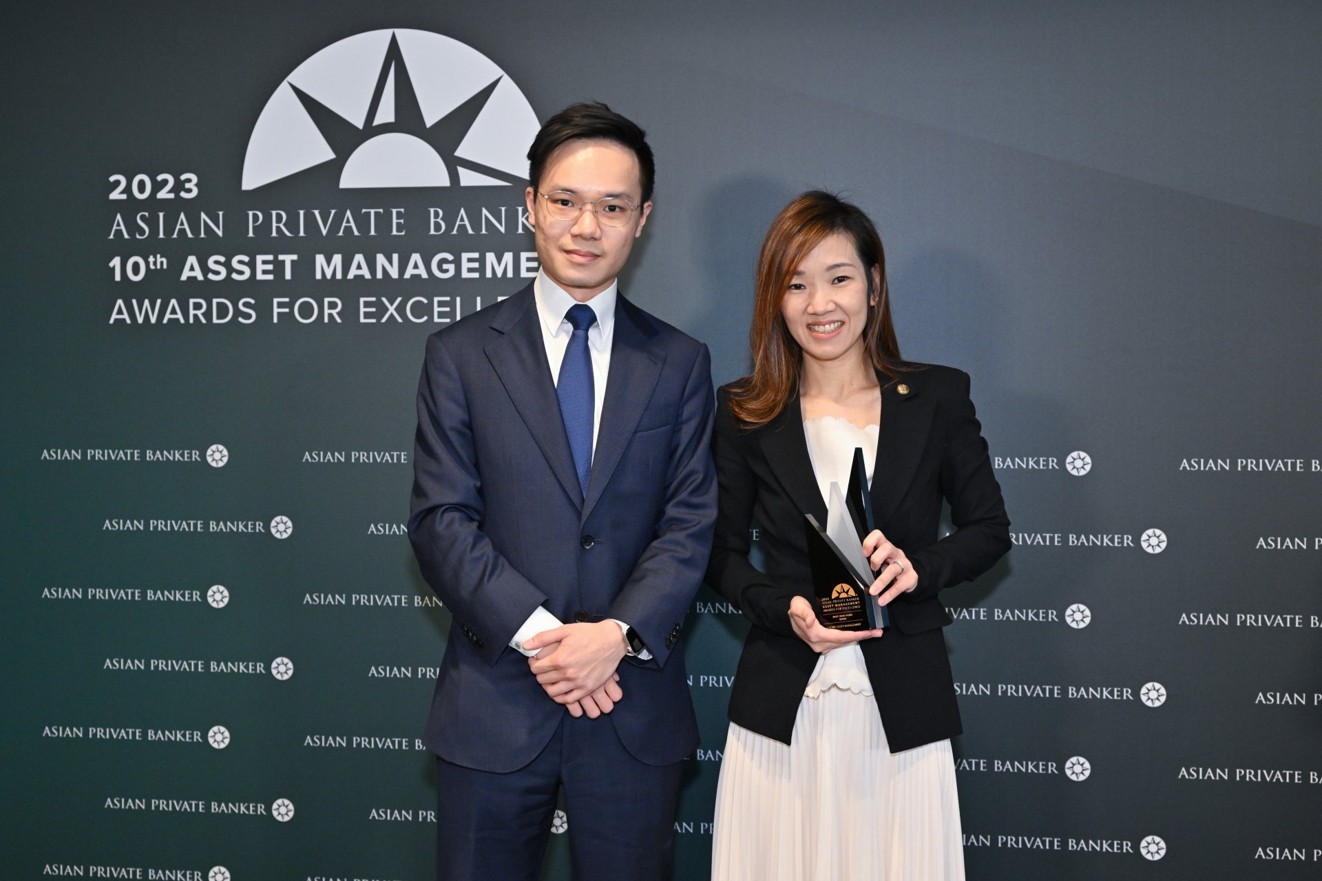 Keith Chan and Natalie Wong of Lazard Asset Management collect their trophy for Best New Fund - Bond