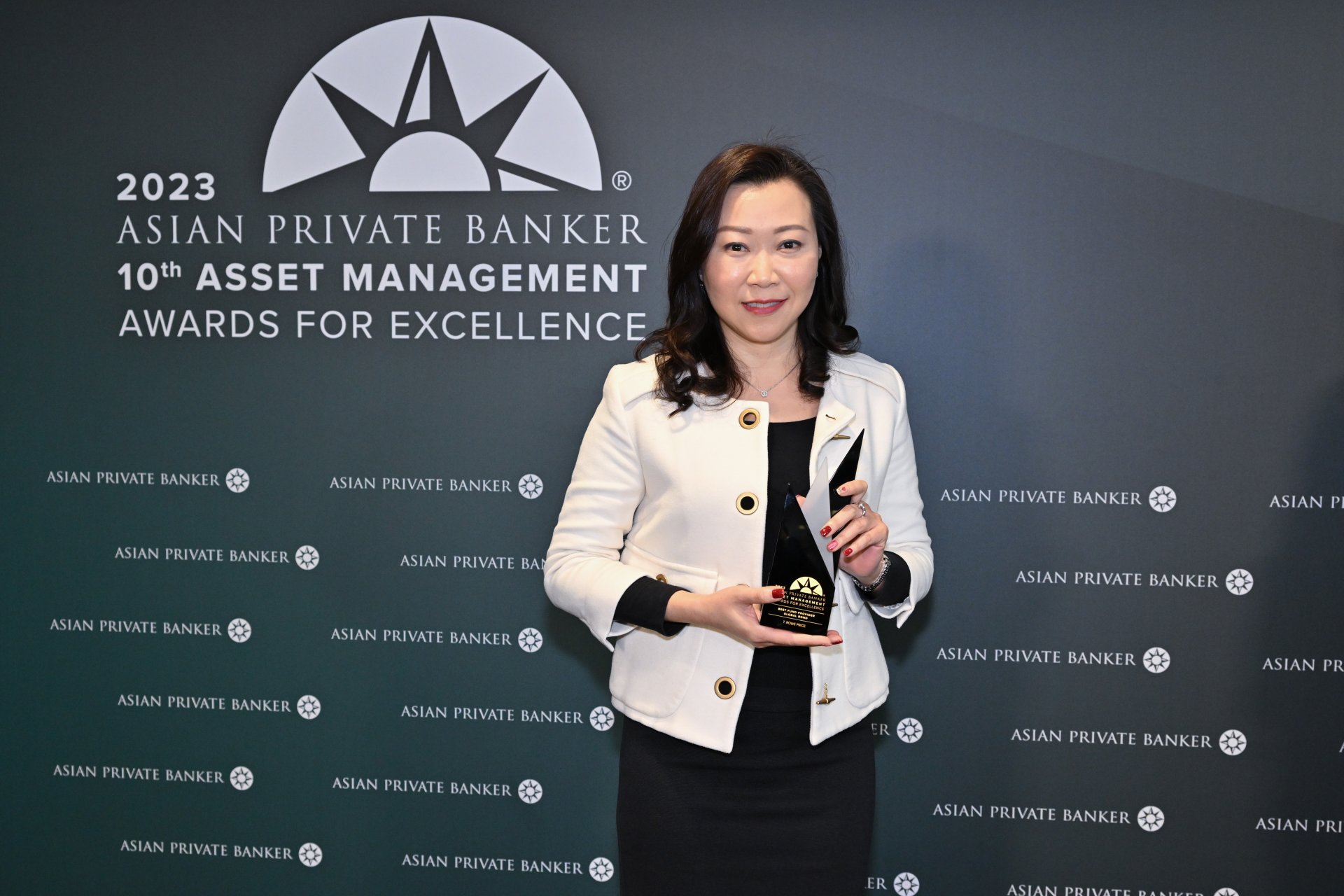 Priscilla Leung collects the award for Best Fund Provider - Global Bond on behalf of T. Rowe Price