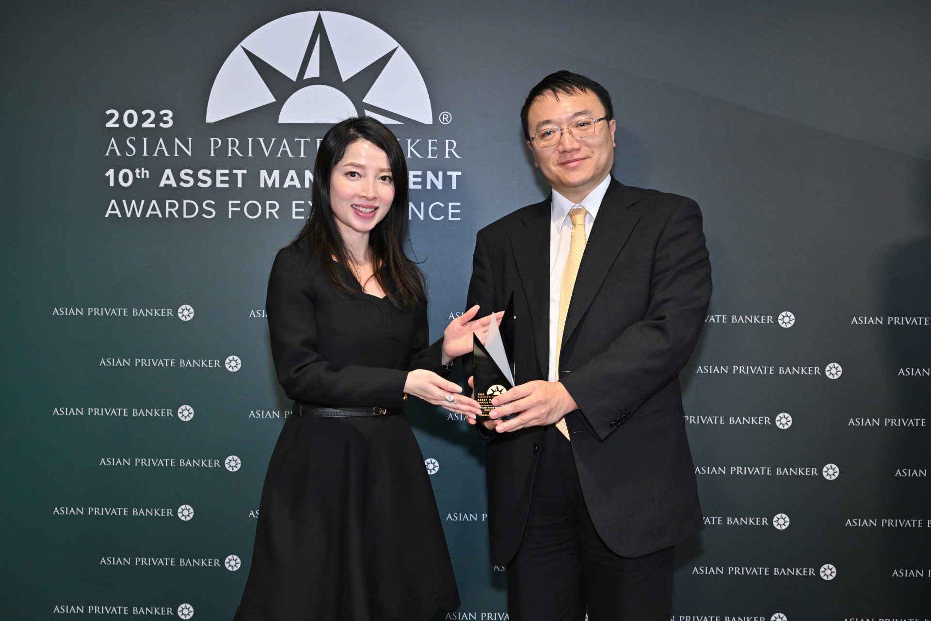 Vicky Yick and John Liu accepting Nomura Asset Management's win for Best Fund Provider - High Yield Bond